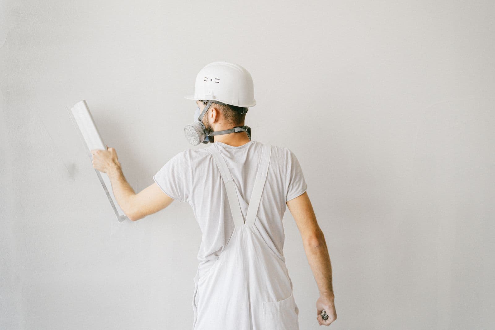 Construction worker finishing a wall